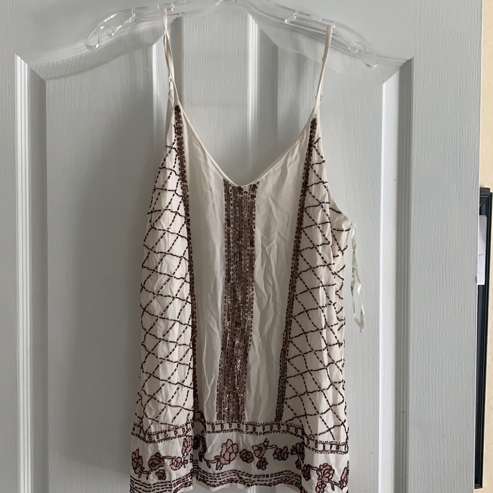South moon under beaded tank
